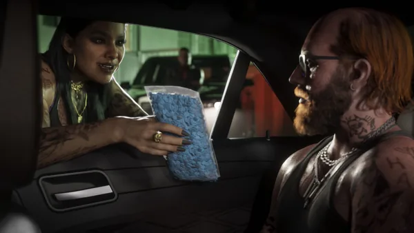 A woman passes a bag of blue pills through a car window.