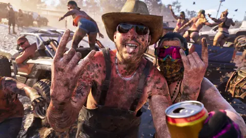 Mud-caked partiers, an off-road buggy and pickups behind them.