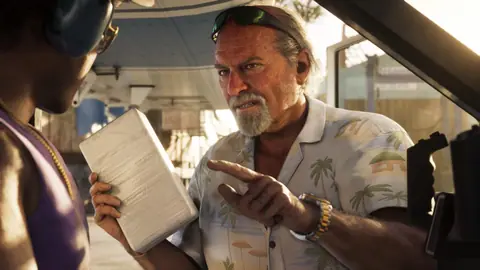 Holding a taped package and pointing at a man in a plane.
