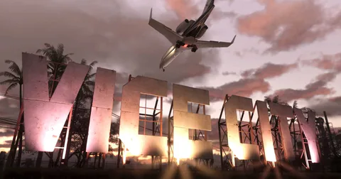 The GTA VI sign stands beside a palm-lined roadway as an aircraft passes overhead.