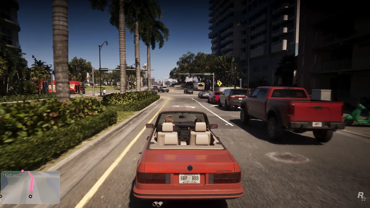 A convertible drives down a palm-lined Vice City street beside a red pickup, the minimap in the corner.