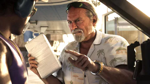 An older bearded man in a floral shirt holds a document and gestures from inside a vehicle in Grand Theft Auto VI.
