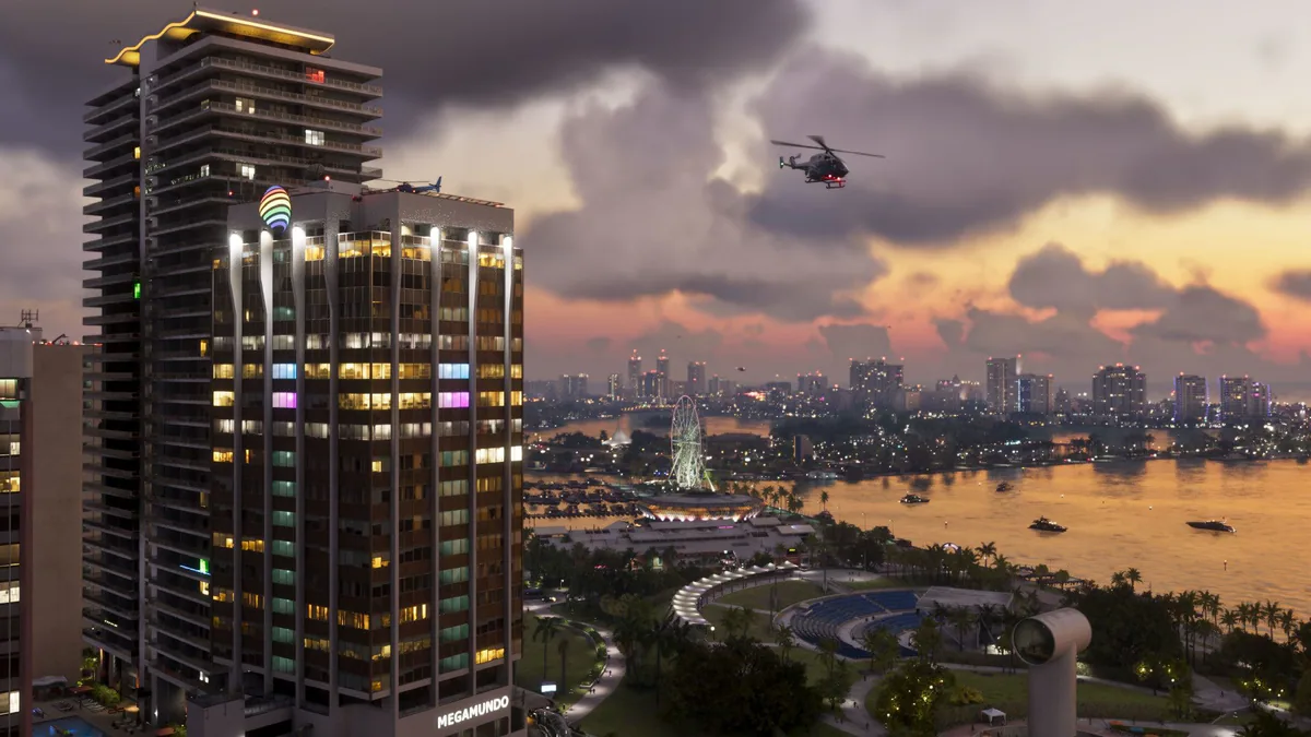 Vice City skyline in Grand Theft Auto VI is shown under dark storm clouds with a helicopter flying nearby.