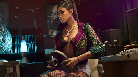 Bae-Luxe in the studio holding headphones, a lava lamp and a mixing desk around her.