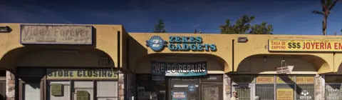 The strip mall: Video Forever, Zekes Gadgets and a pawn shop.