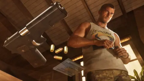 Loading a magazine in a Leonida tank top, a pistol and loose rounds in the foreground.
