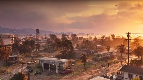 Port Gellhorn at sunset: trailers, dirt roads and a water tower.