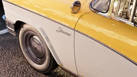 The Stanier script badge on the front fender.